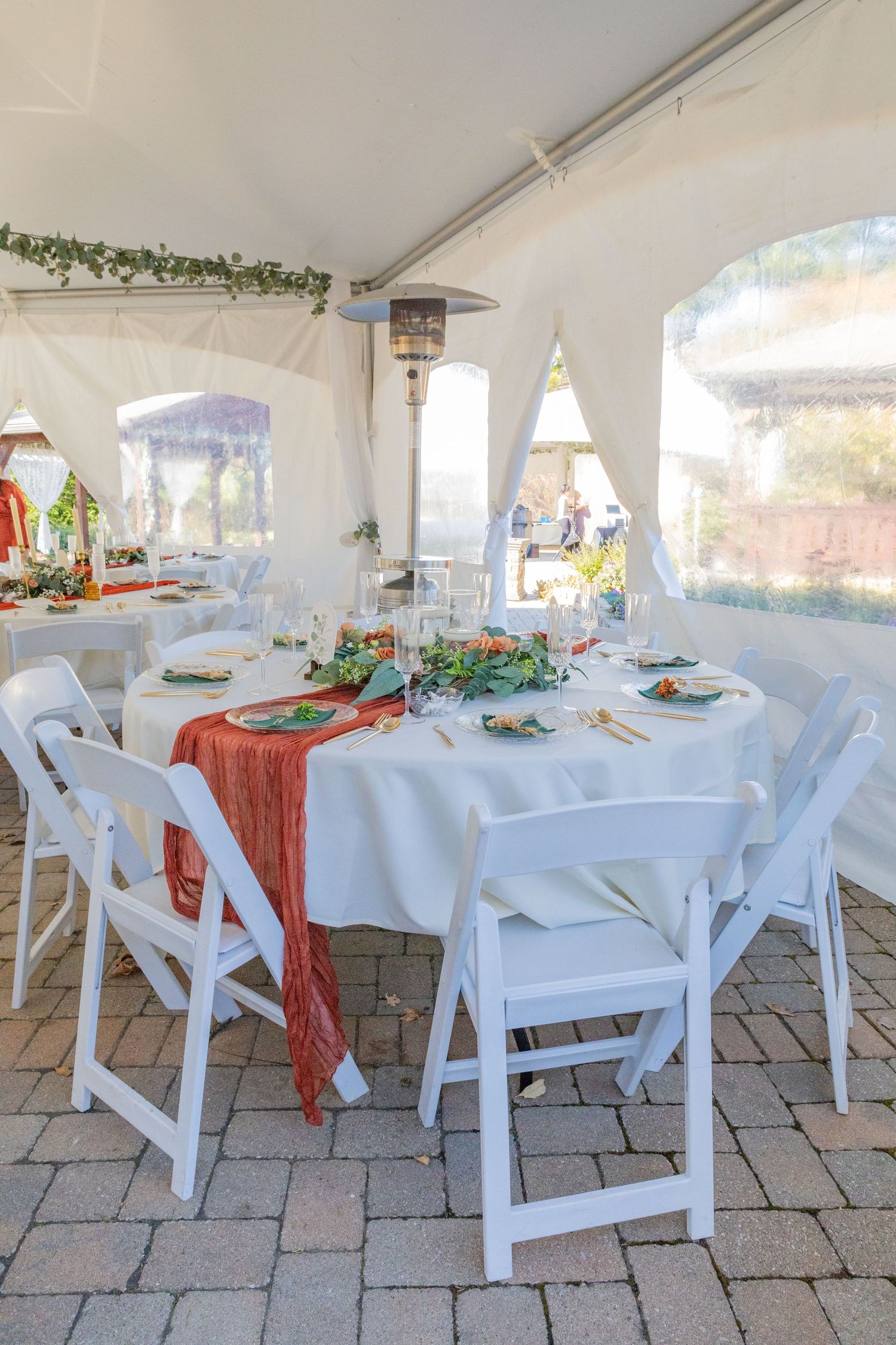 all white tent setup for cocktail hour during a wedding in avon indiana at the avon gardens