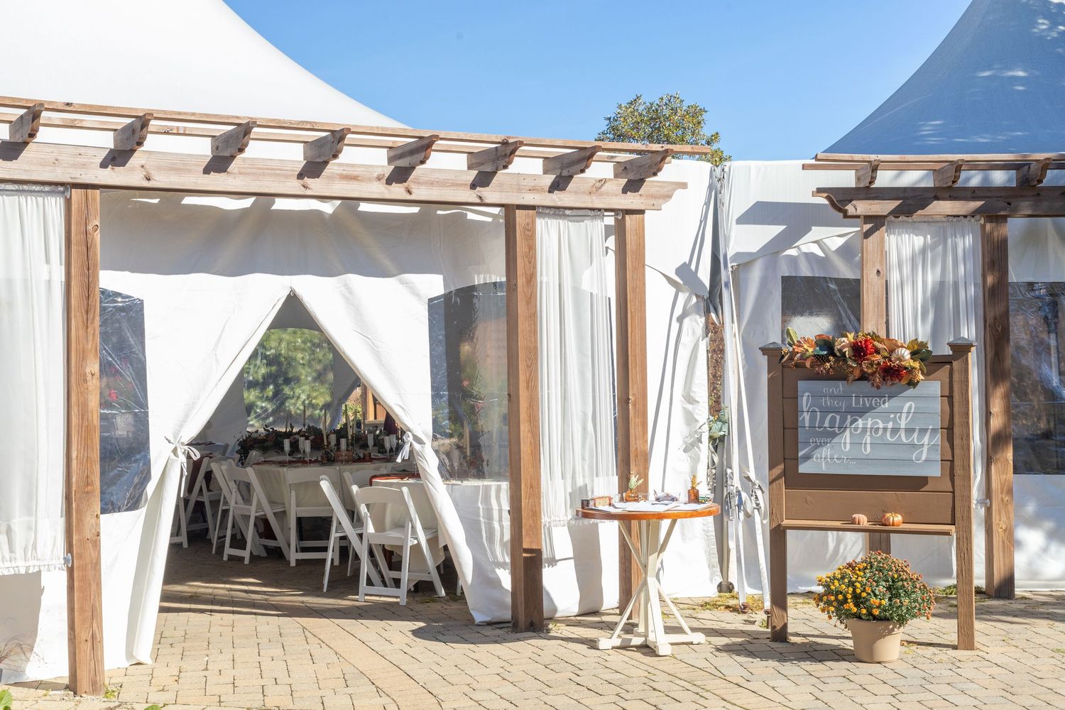 white tent welcoming the guest for a wedding in avon indiana at the avon gardens