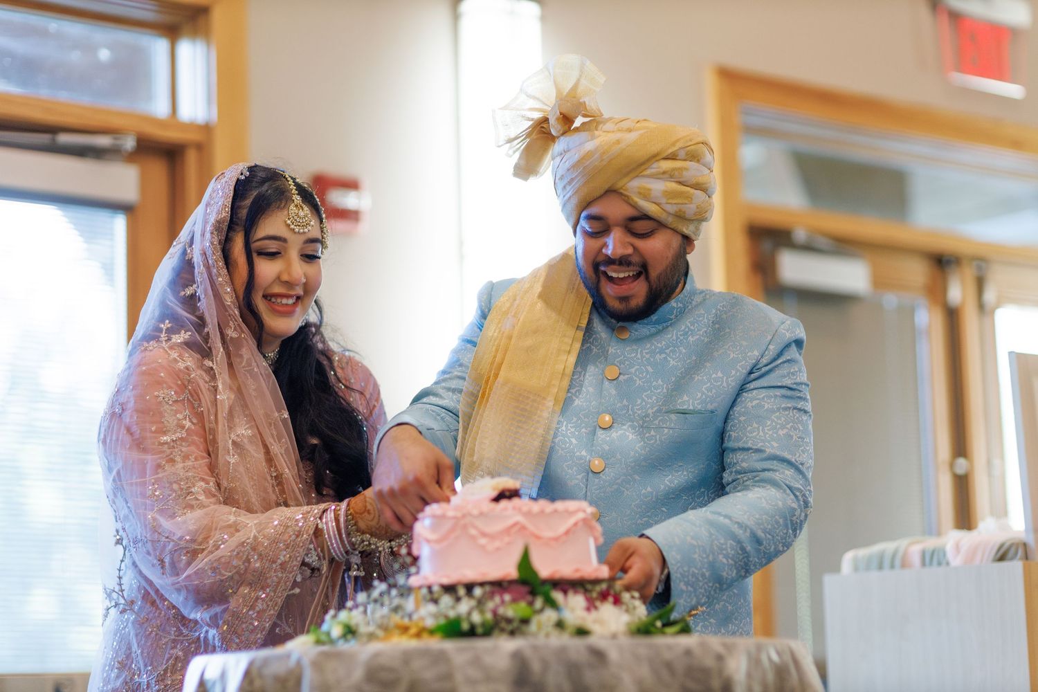 couple cutting cake at their wedding in avon indiana at washington township Pavilion