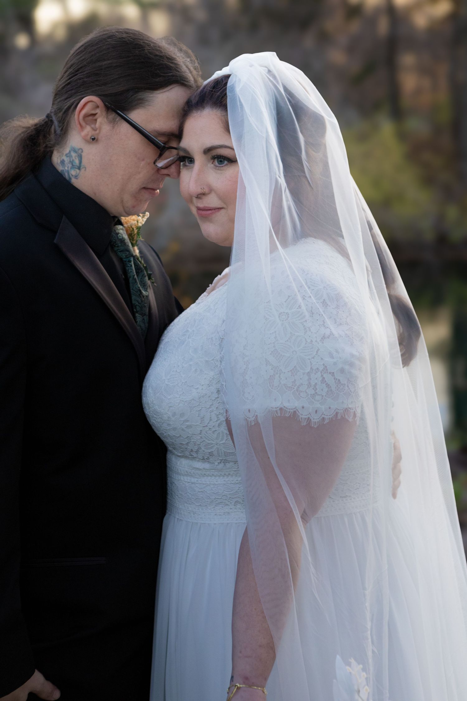 beautiful couple holding each other during a wedding in avon indiana at the avon gardens