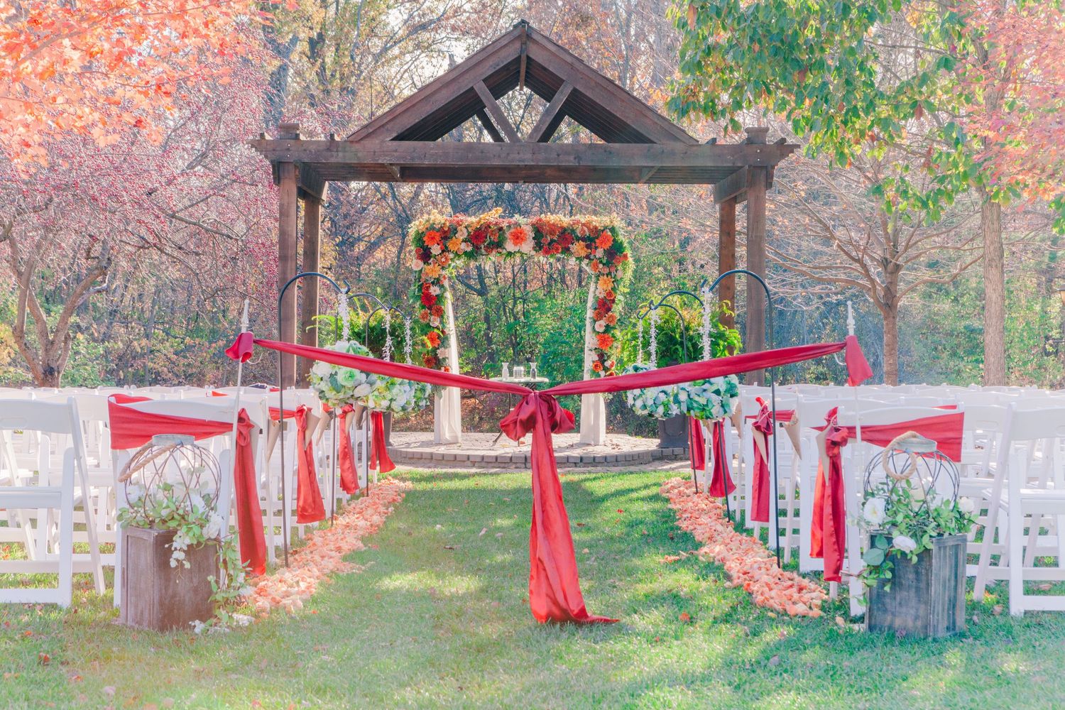 a very vibrant wedding asle with beautiful red decor in avon indiana at the avon gardens