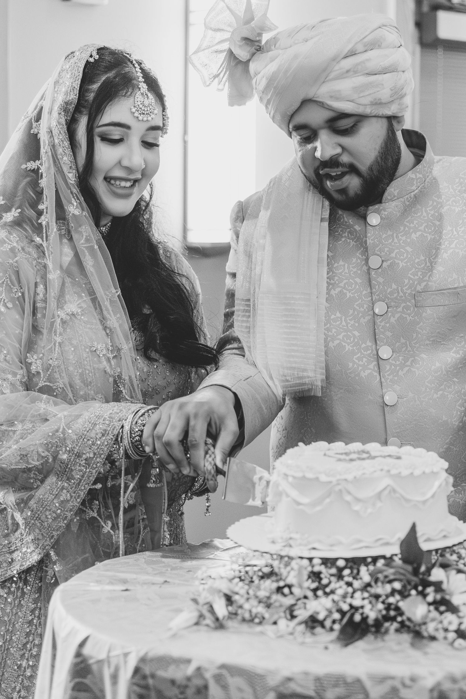 couple cutting cake at their wedding in avon indiana at washington township Pavilion