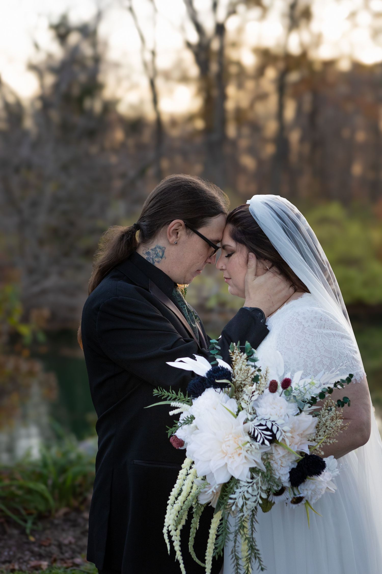 beautiful couple holding each other during a wedding in avon indiana at the avon gardens