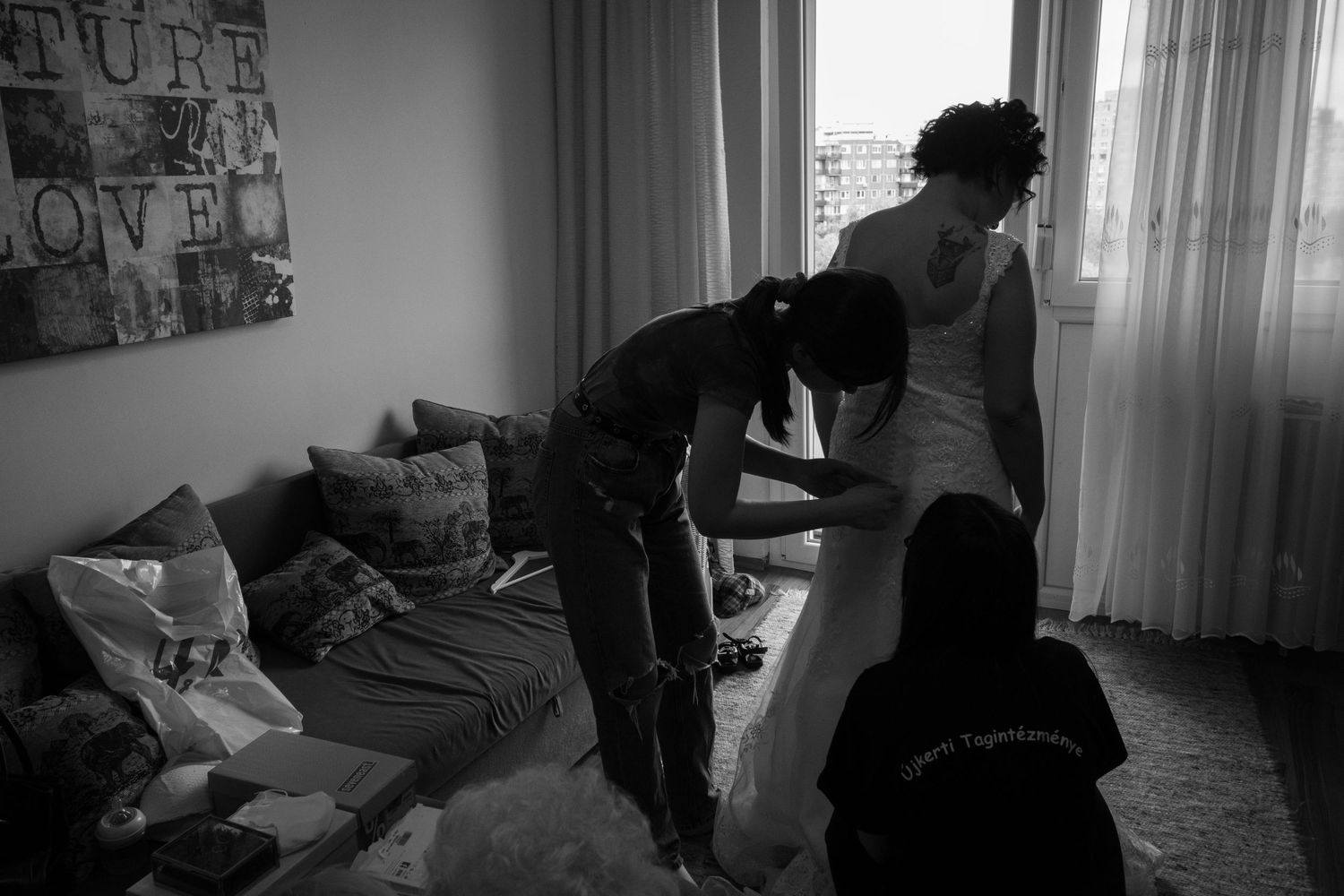 Black and white candid moments during wedding day preparations.