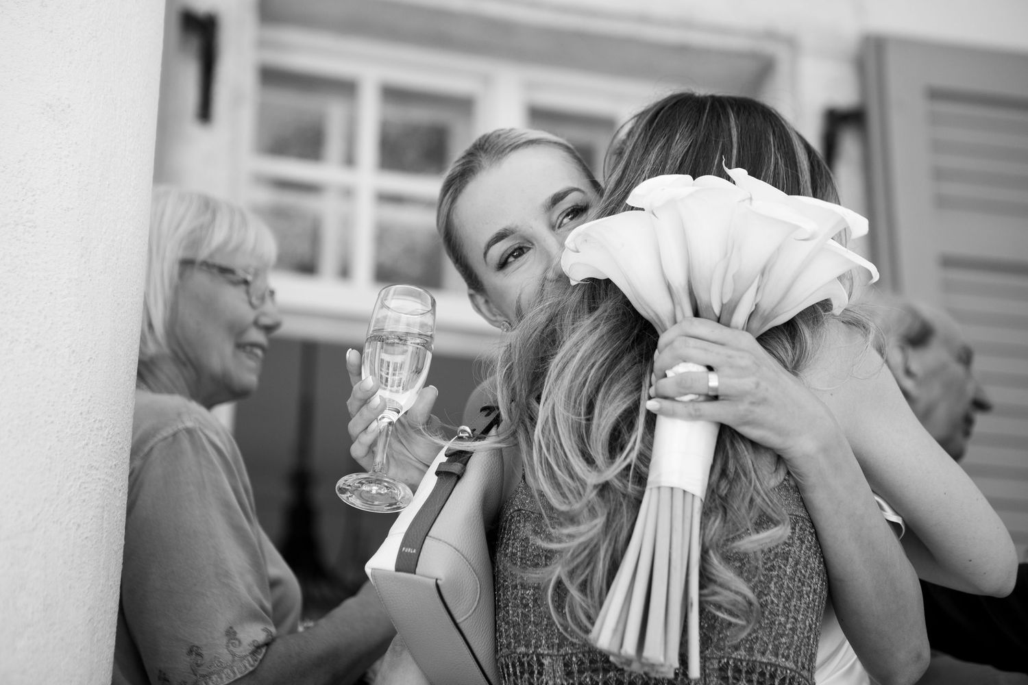 Guests enjoying candid moments at an elegant outdoor wedding celebration.