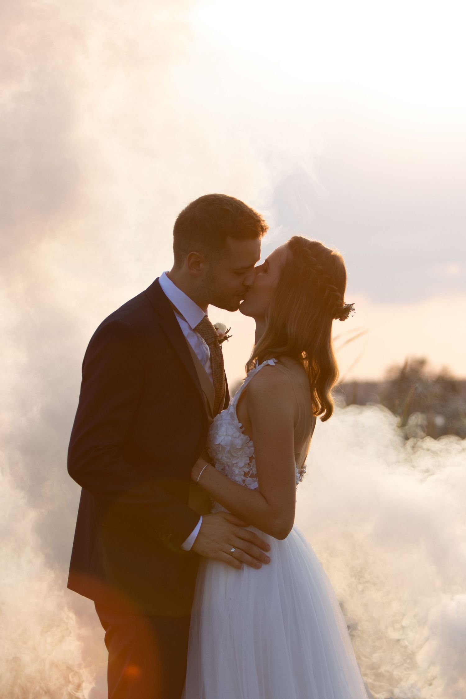 Golden hour wedding portrait of couple sharing an intimate moment.