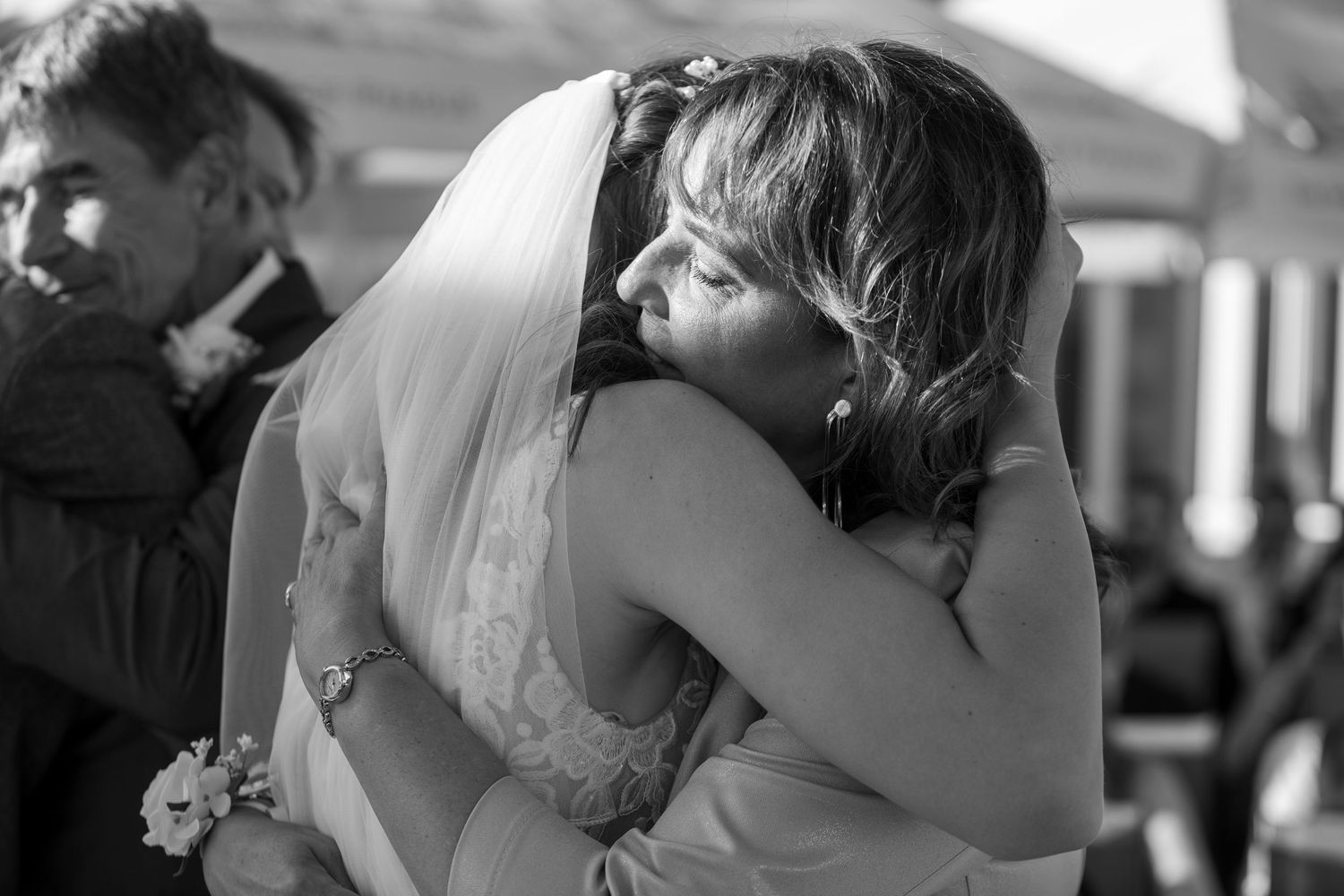 Close-up black and white shot of a tender wedding moment.