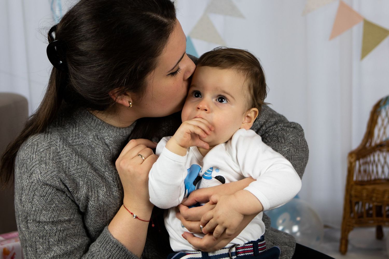 Sweet indoor portrait session with soft lighting and festive decorations.