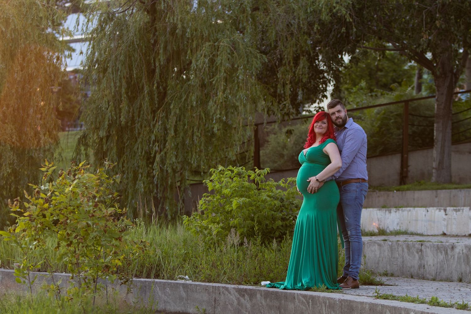 Romantic outdoor photo session with couple against natural wooded backdrop.
