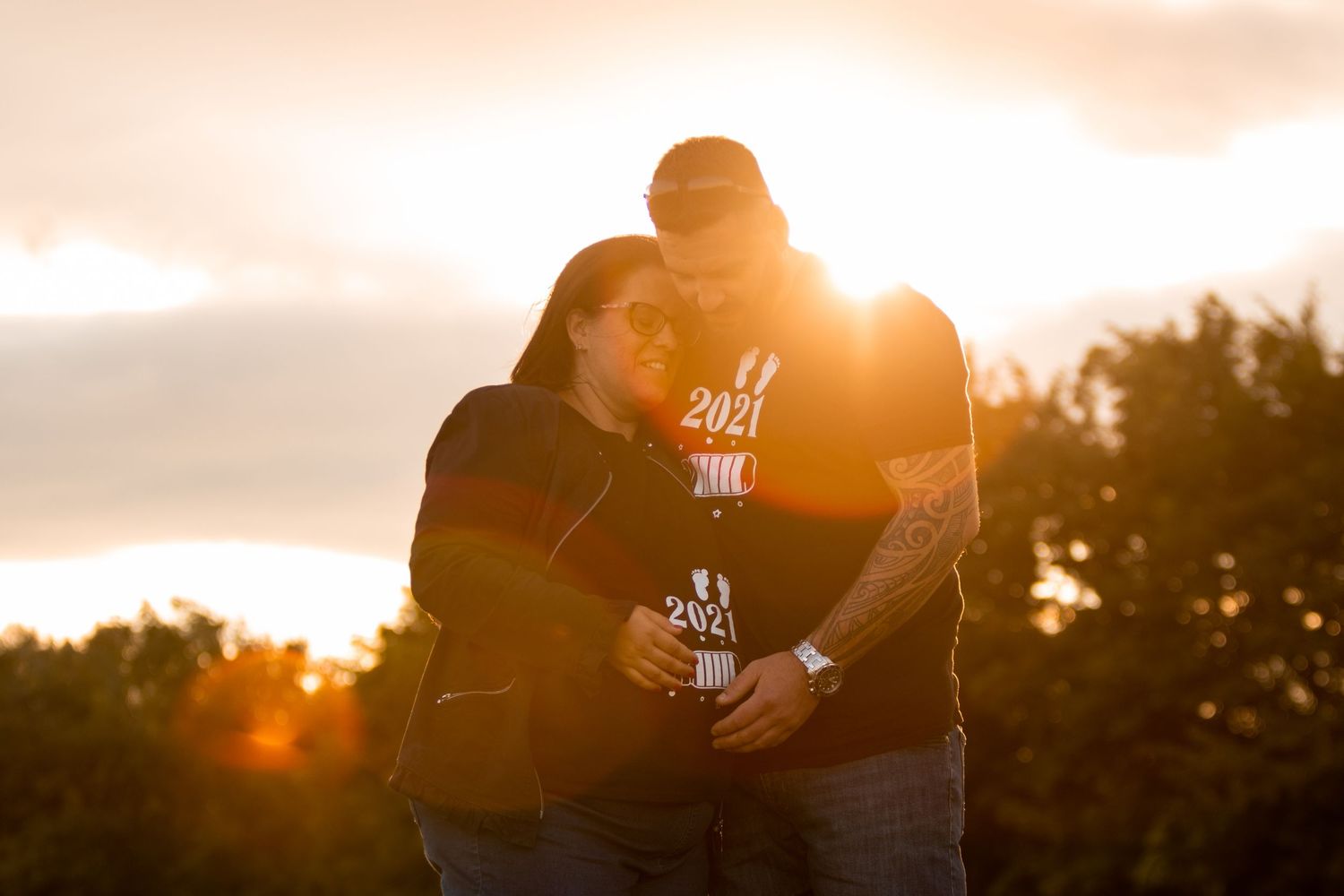 Sunset silhouettes against a warm sky create a romantic golden hour atmosphere.