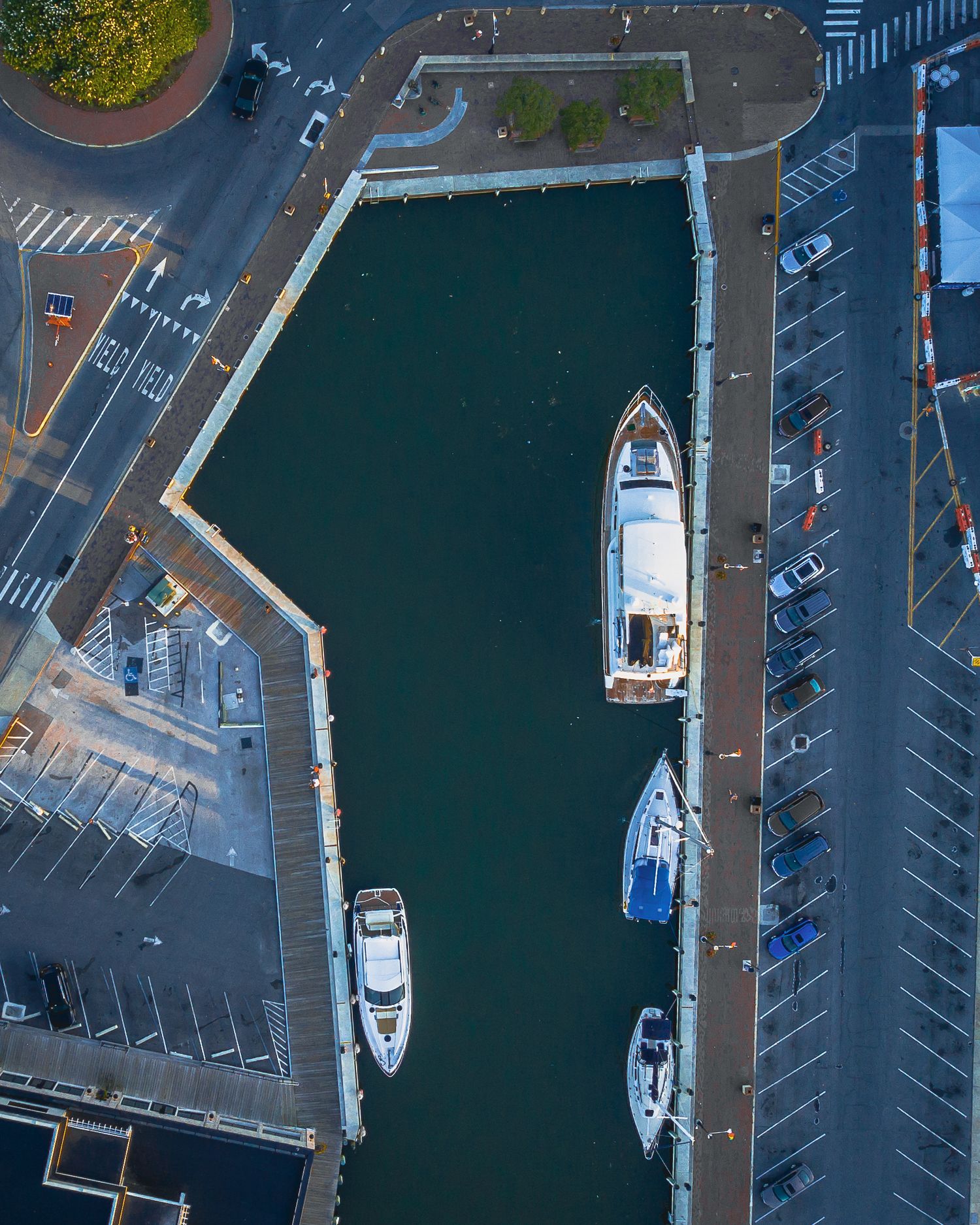 Top-down aerial view of a boats docked in a narrow waterway in Annapolis.