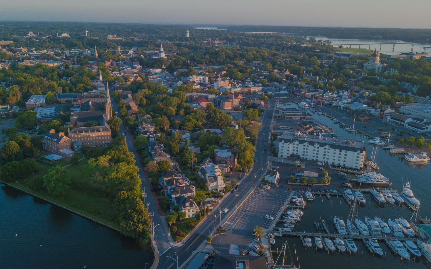 Aerial view of Annapolis from the Eastport Bridge, showing the city and the Maryland State House in the distance.