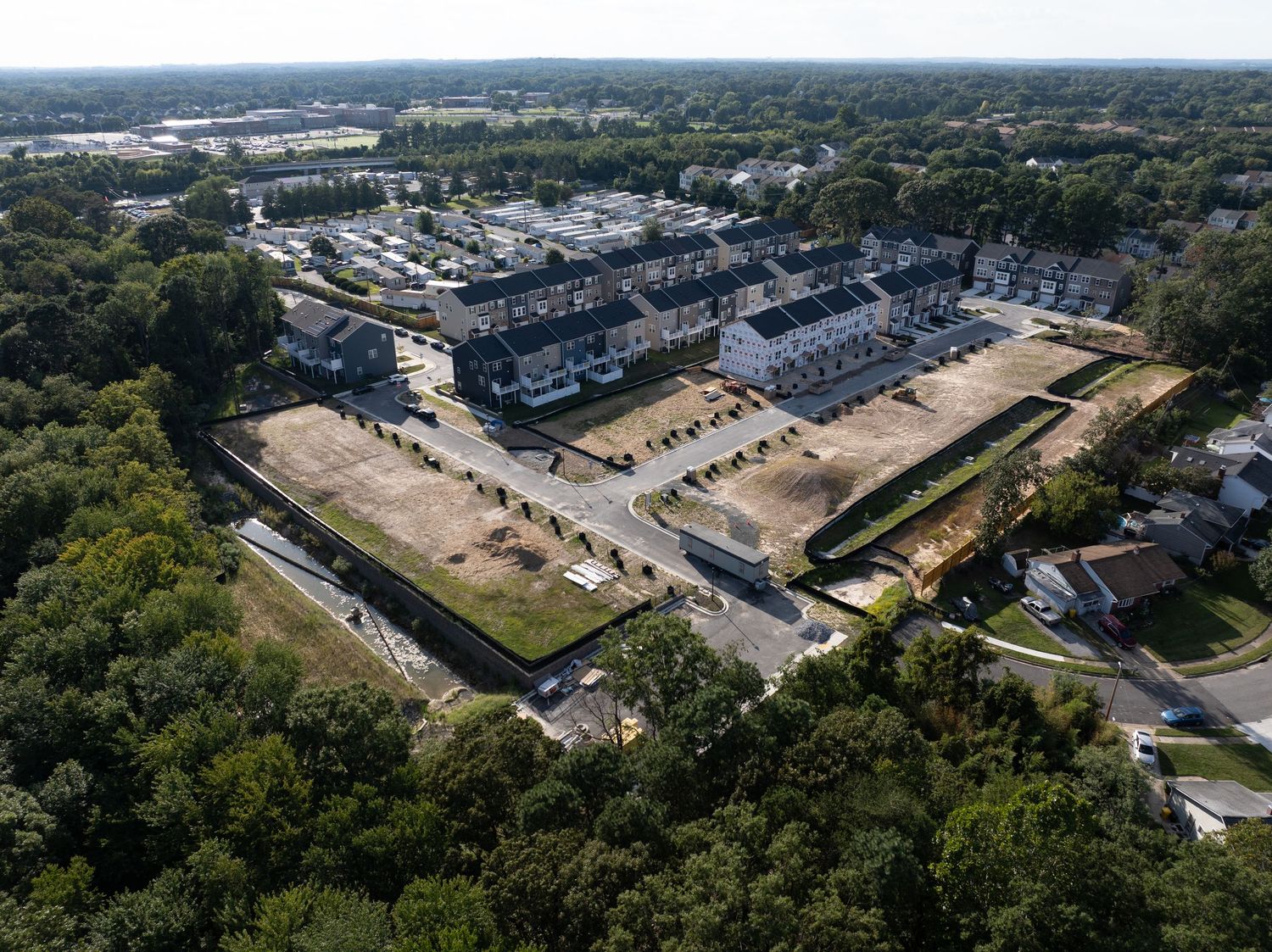Aerial view of residential homes and streets as surrounding construction continues.