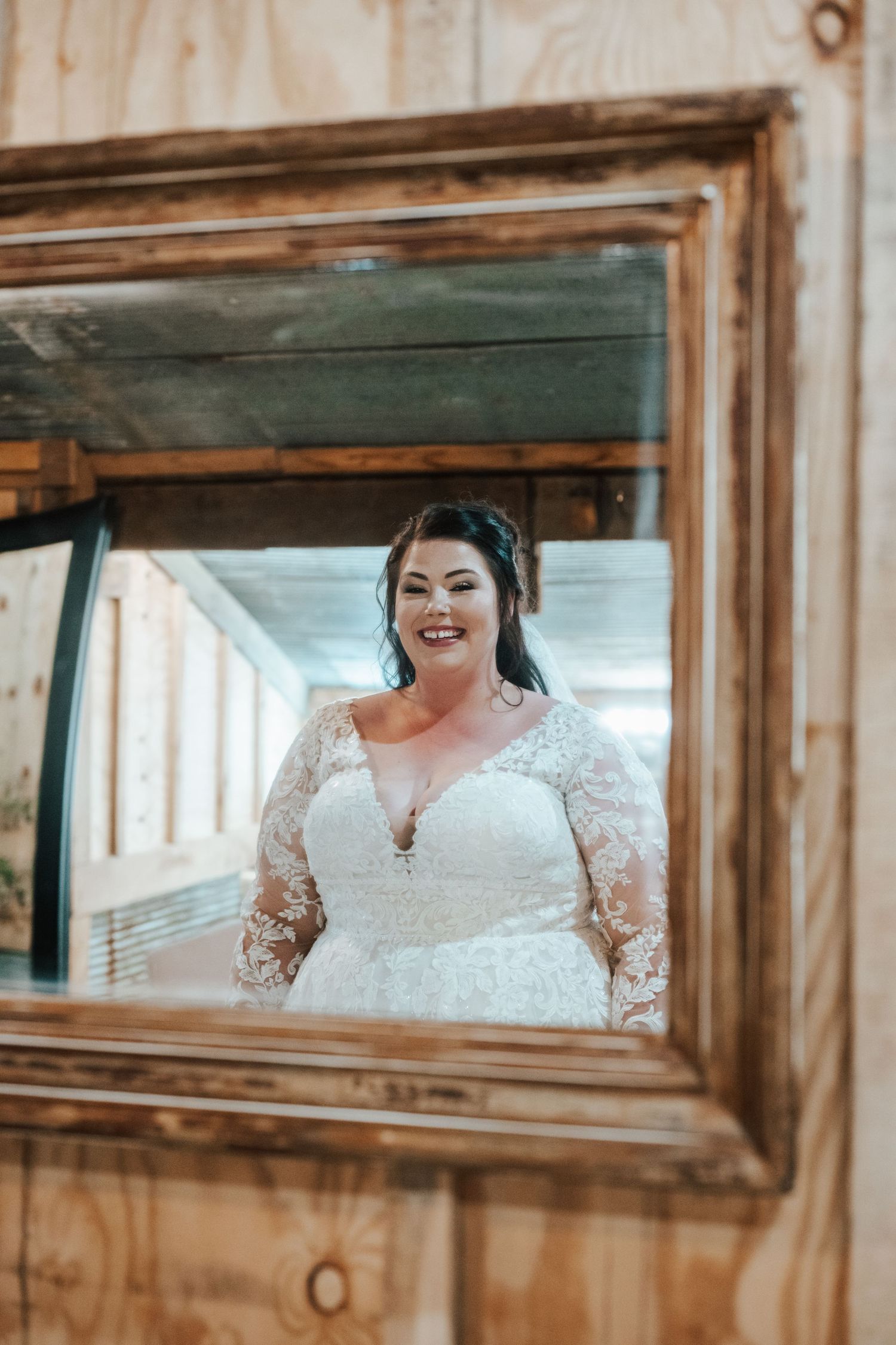 A Bride thinking about her life as she looks in the mirror on her wedding day