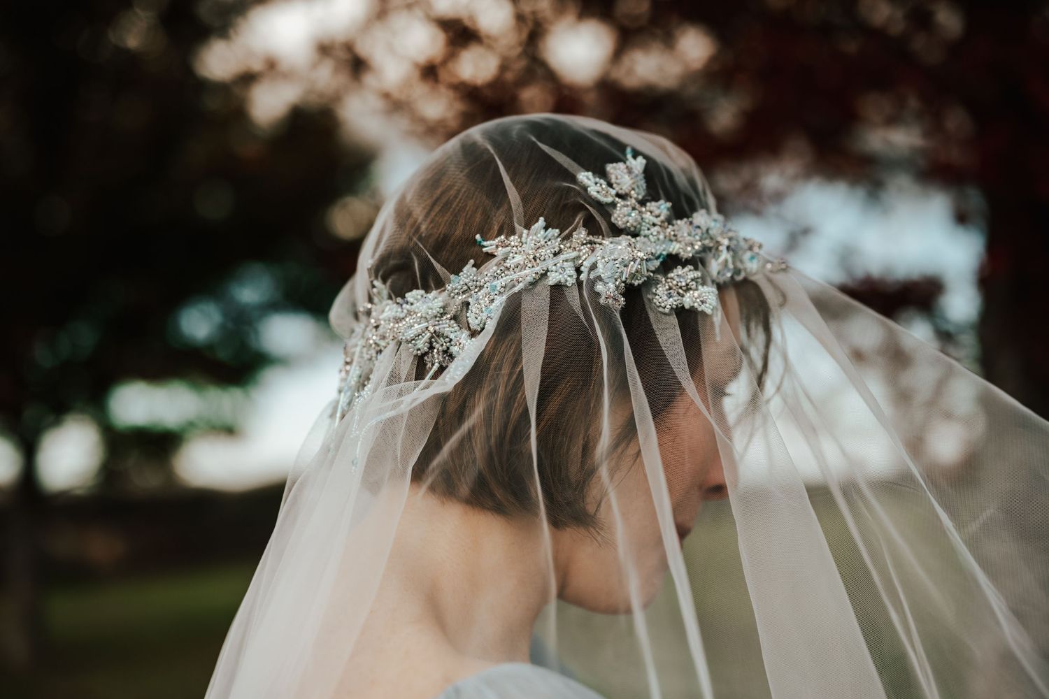 Bride moments during their outdoor wedding photoshoot in a natural setting.
