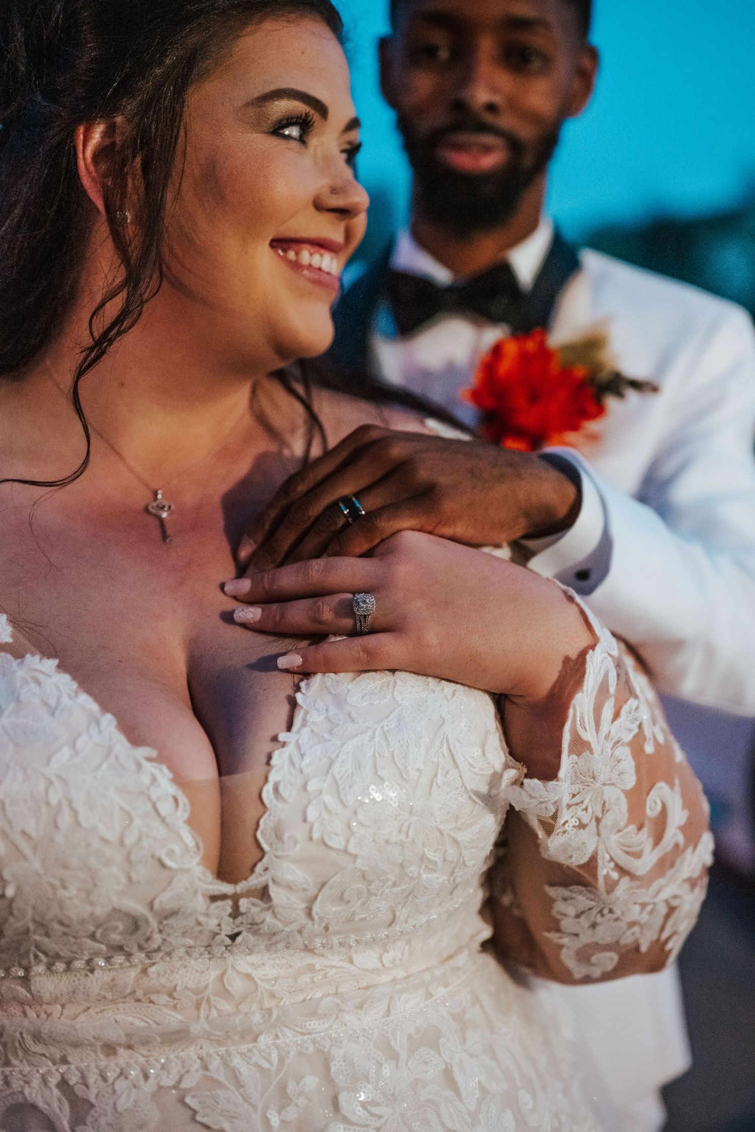 Close-up wedding photos showing elegant white lace dress details and tender romantic moments between newlyweds.