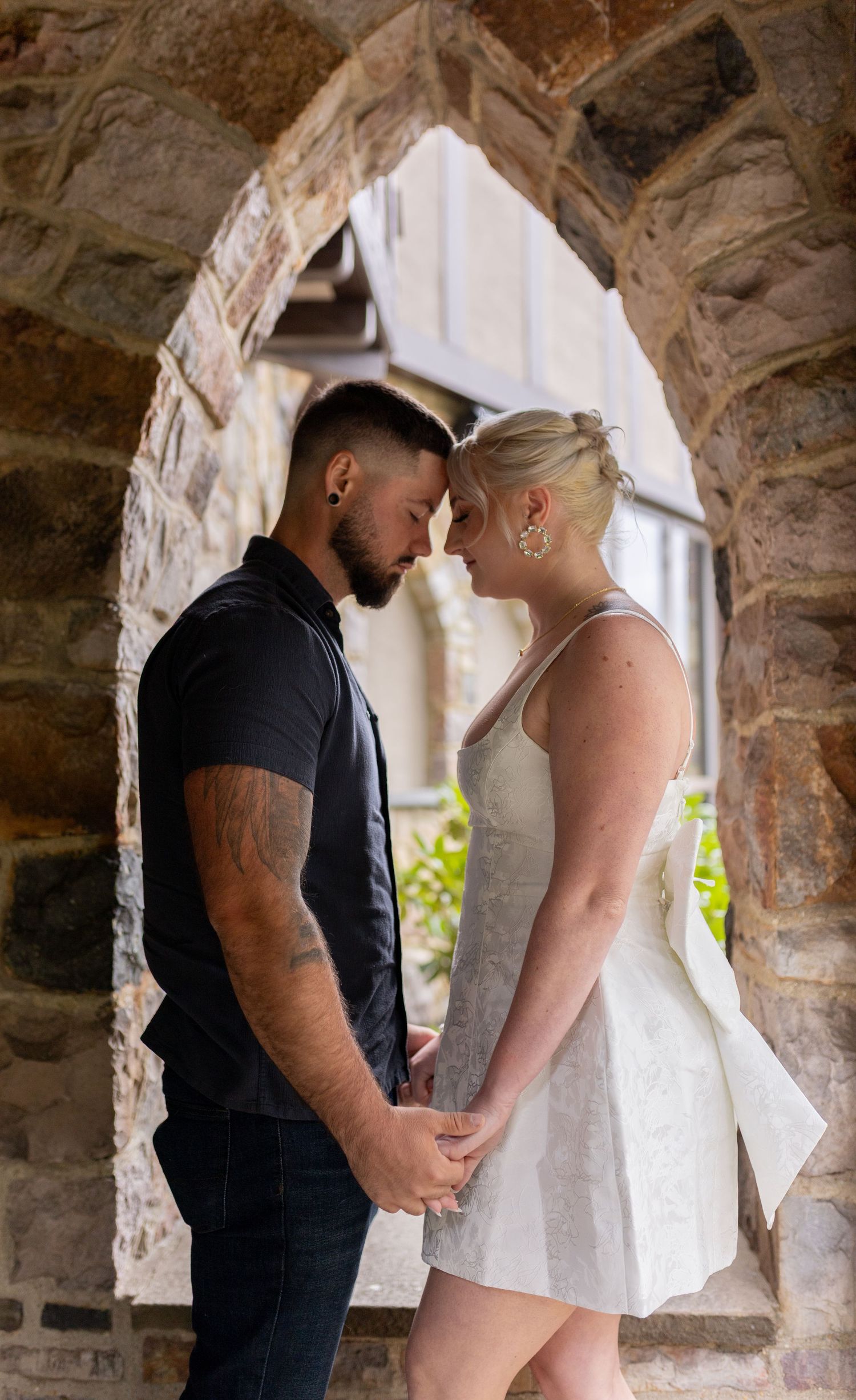 Intimate and cozy engagement session moment with a warm, moody aesthetic inside Stokesay Castle.