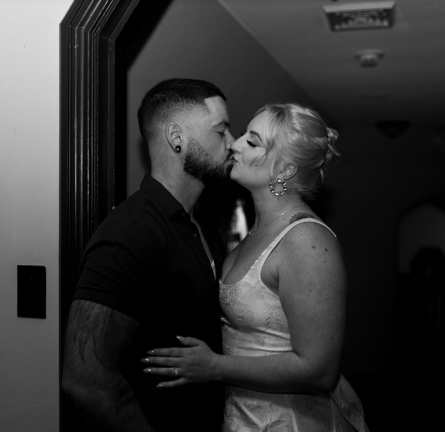 Intimate and cozy engagement session moment with a warm, moody aesthetic inside Stokesay Castle.