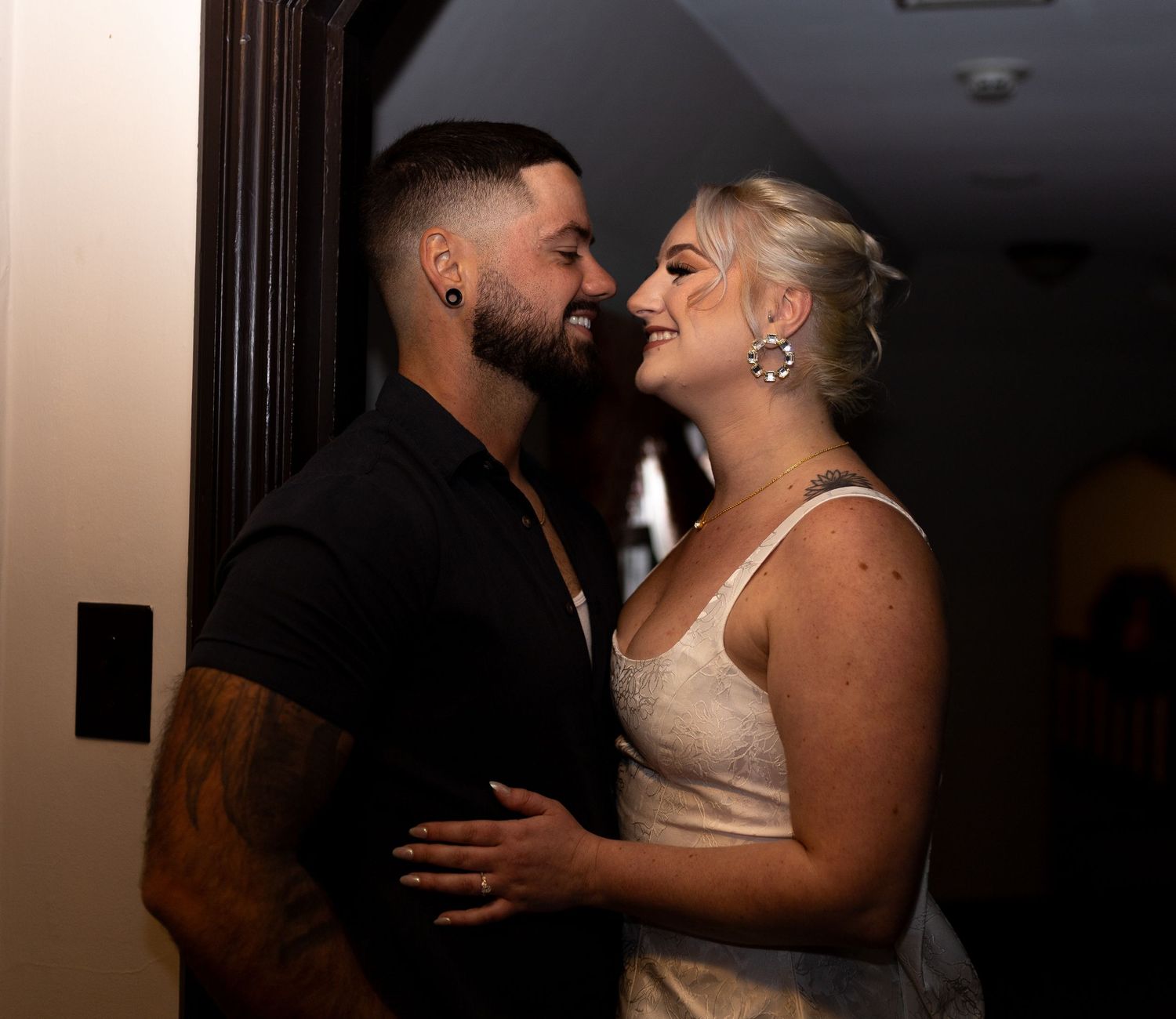 Intimate and cozy engagement session moment with a warm, moody aesthetic inside Stokesay Castle.