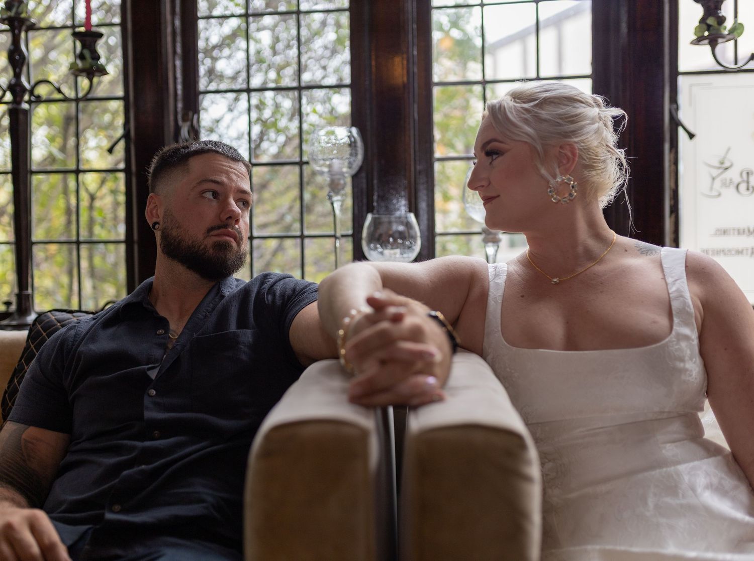Intimate and cozy engagement session moment with a warm, moody aesthetic inside Stokesay Castle.