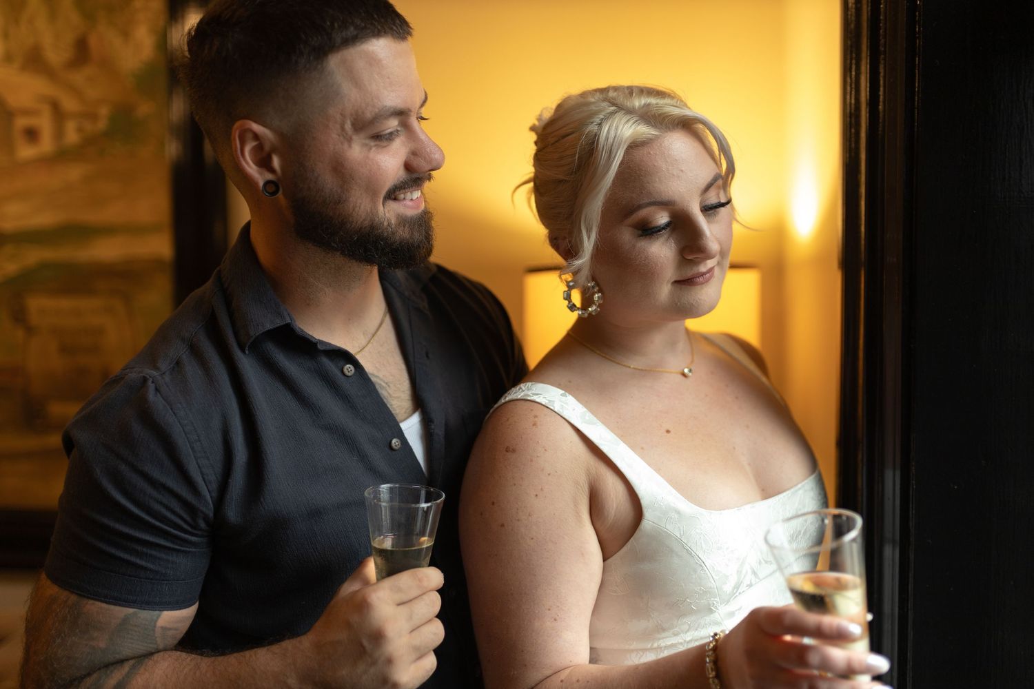 Intimate and cozy engagement session moment with a warm, moody aesthetic inside Stokesay Castle.