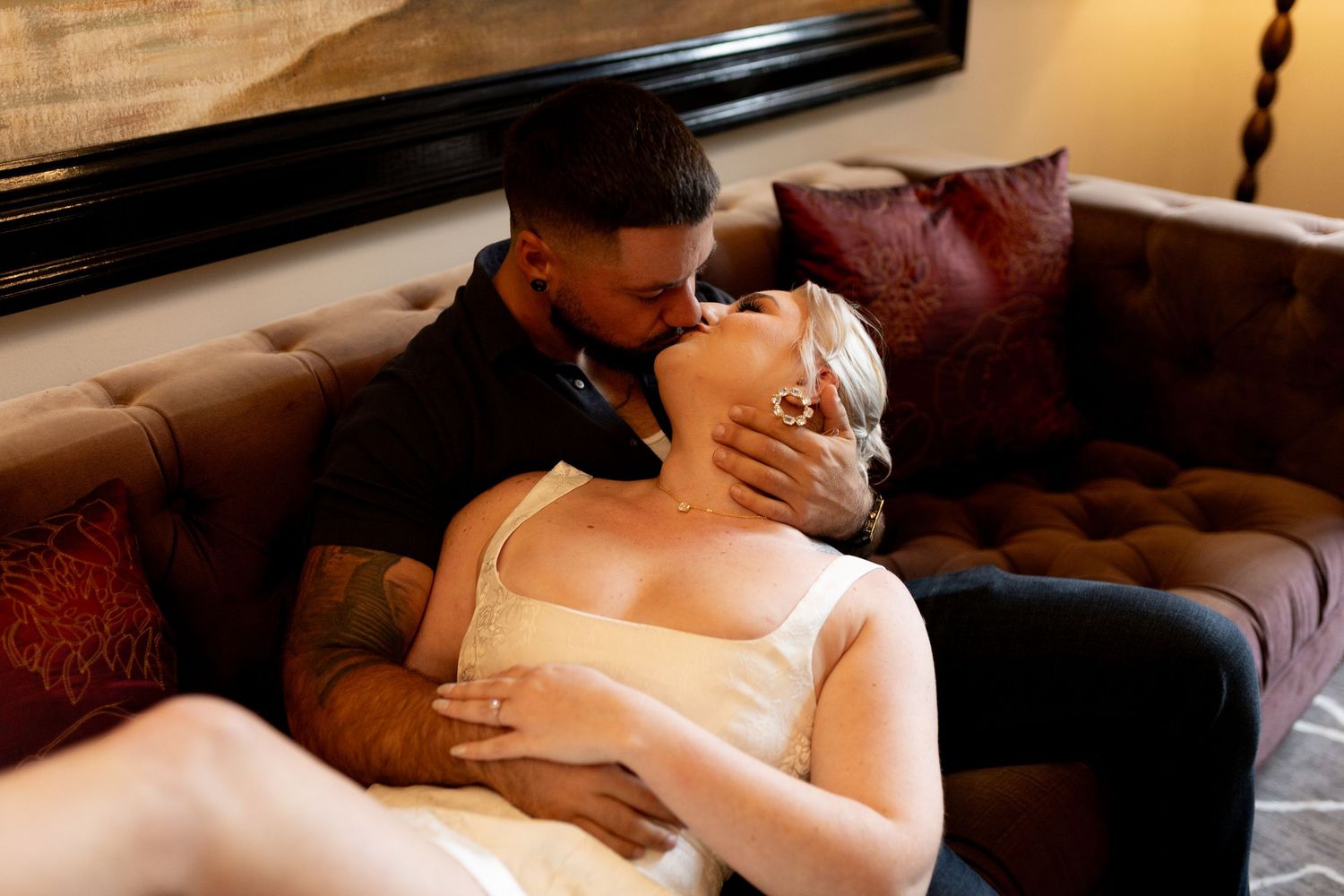 Intimate and cozy engagement session moment with a warm, moody aesthetic inside Stokesay Castle.