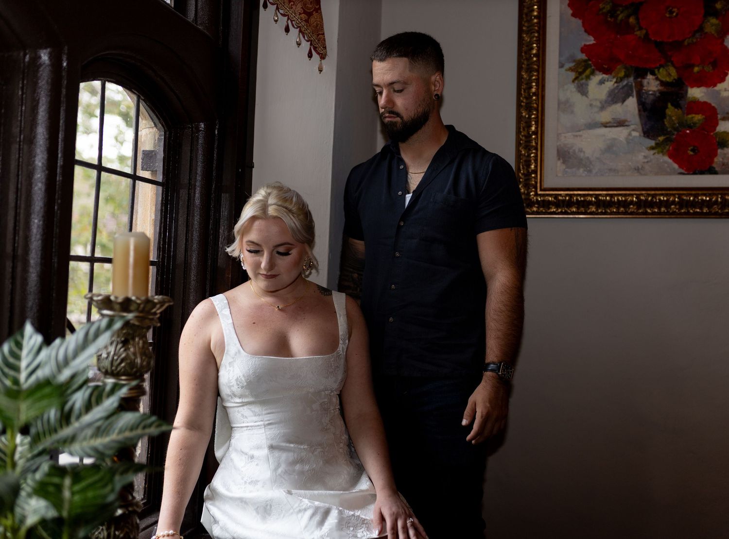 Intimate and cozy engagement session moment with a warm, moody aesthetic inside Stokesay Castle.