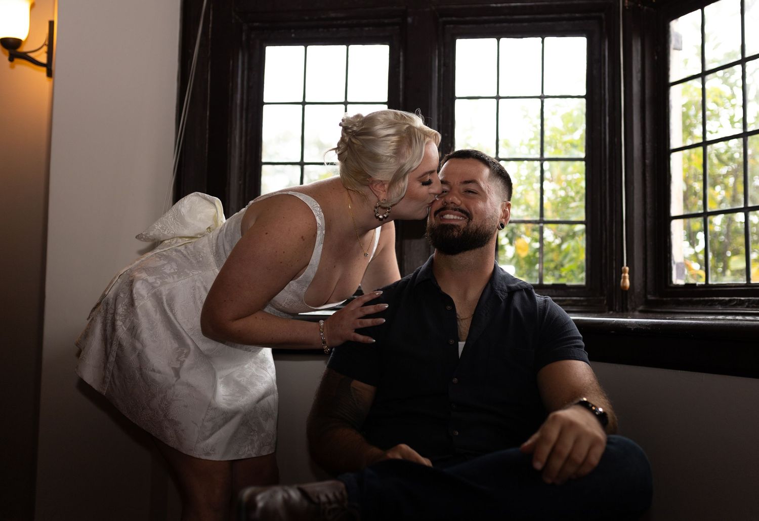 Intimate and cozy engagement session moment with a warm, moody aesthetic inside Stokesay Castle.