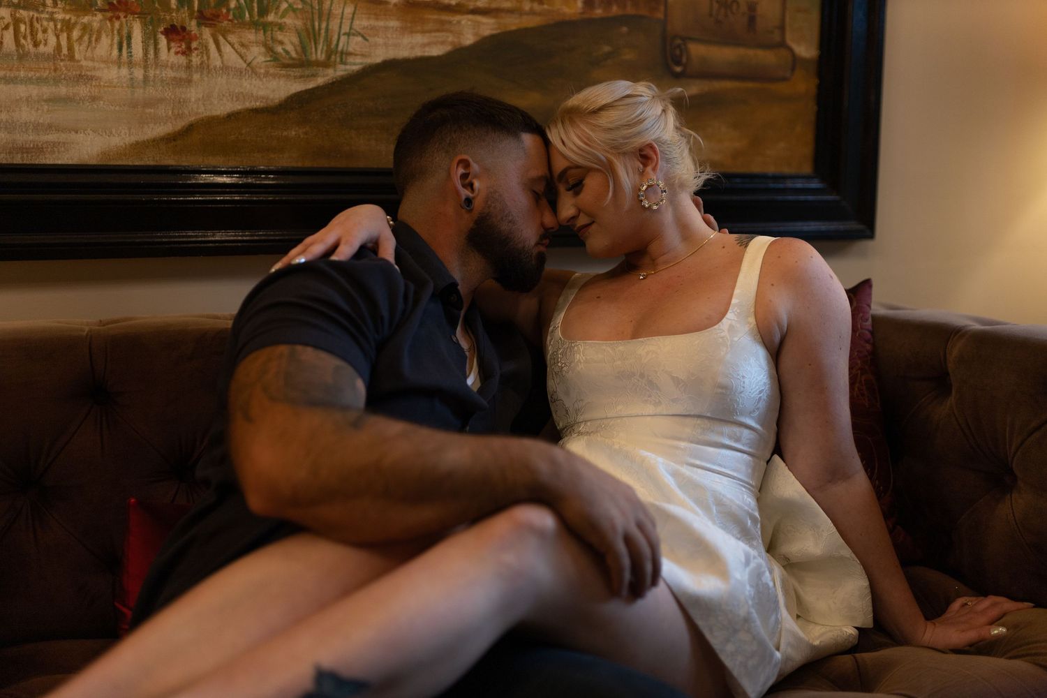 Intimate and cozy engagement session moment with a warm, moody aesthetic inside Stokesay Castle.