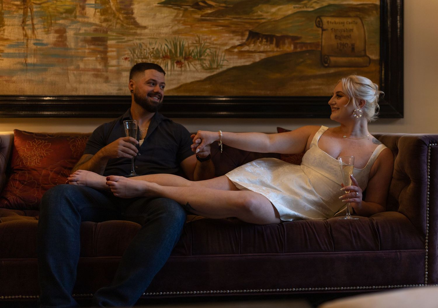 Intimate and cozy engagement session moment with a warm, moody aesthetic inside Stokesay Castle.
