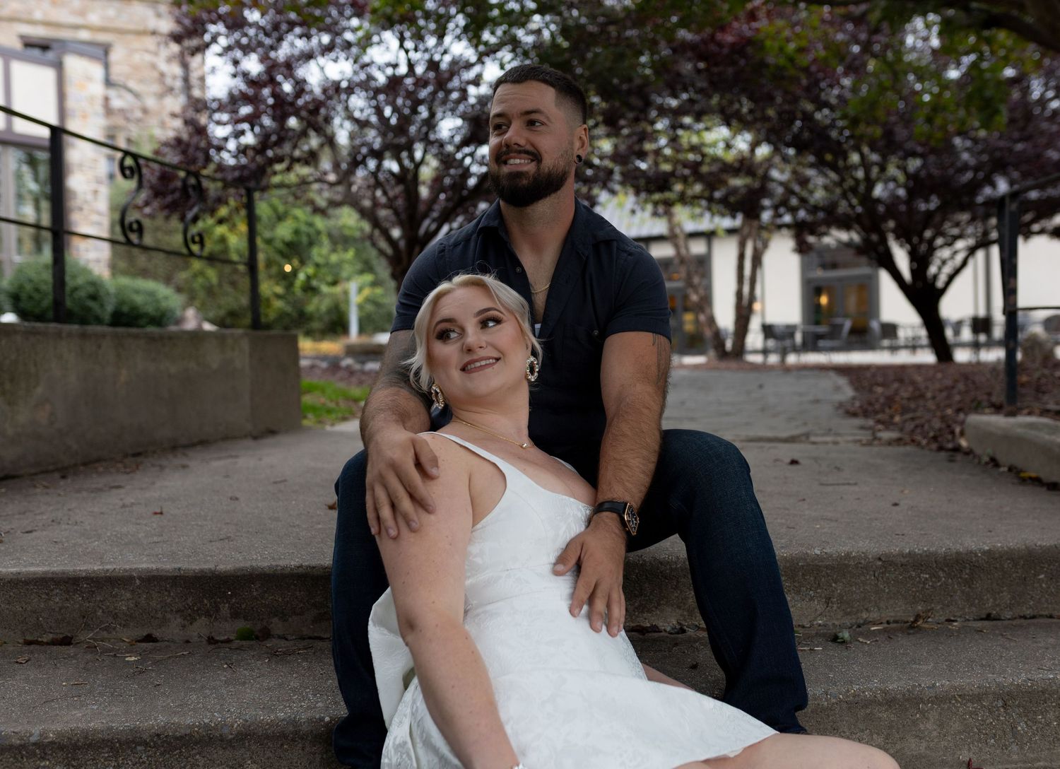 Romantic couple's portrait in front of the stone architecture at Stokesay Castle in Reading, PA.