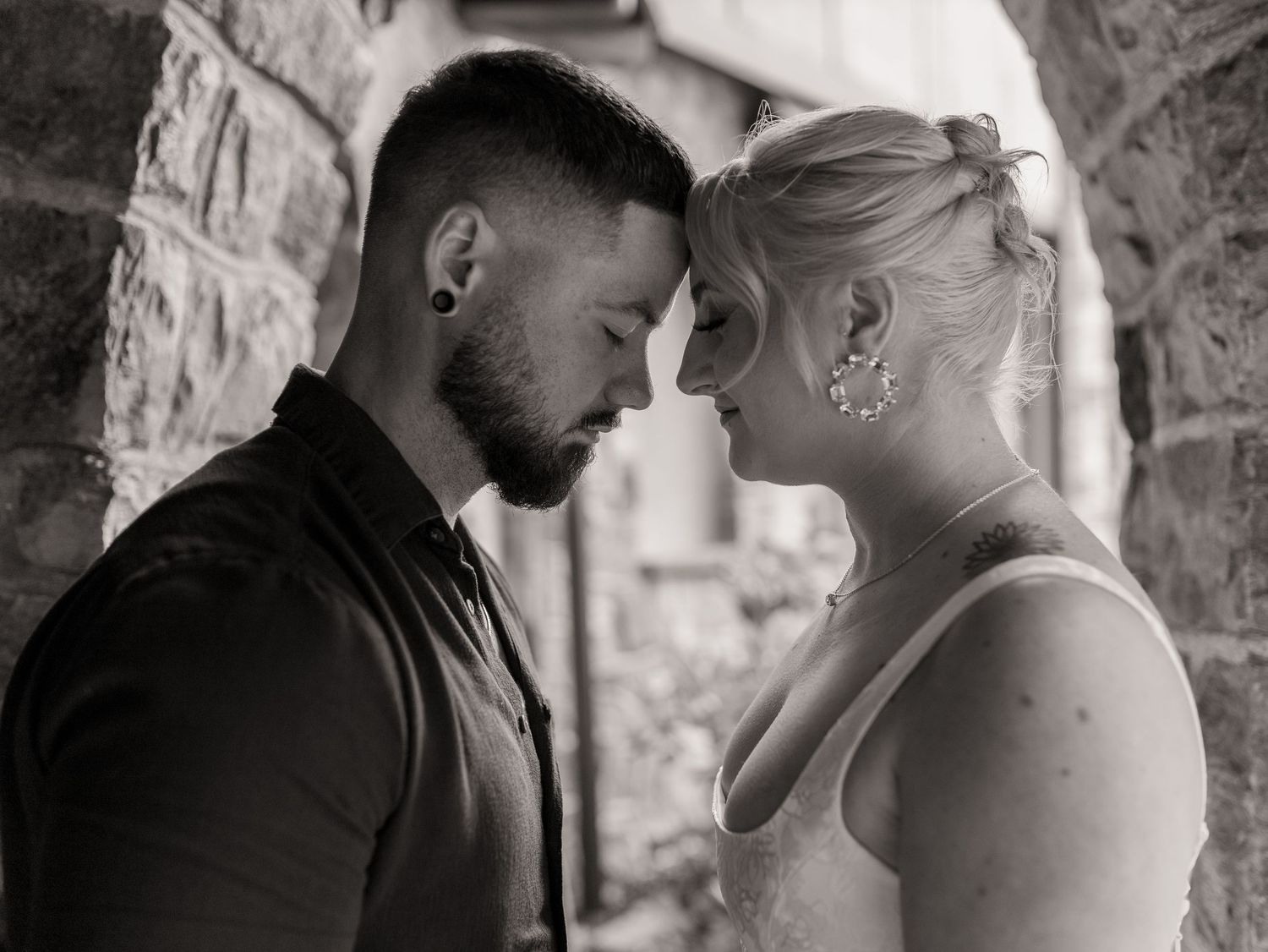 Intimate and cozy engagement session moment with a warm, moody aesthetic inside Stokesay Castle.