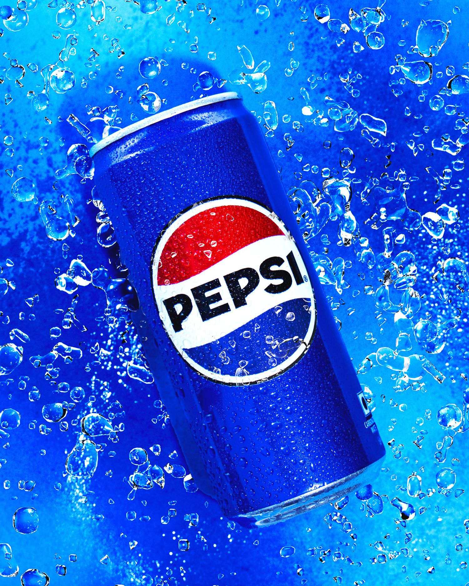 A chilled Pepsi can covered in water droplets surrounded by ice and splashing blue water.