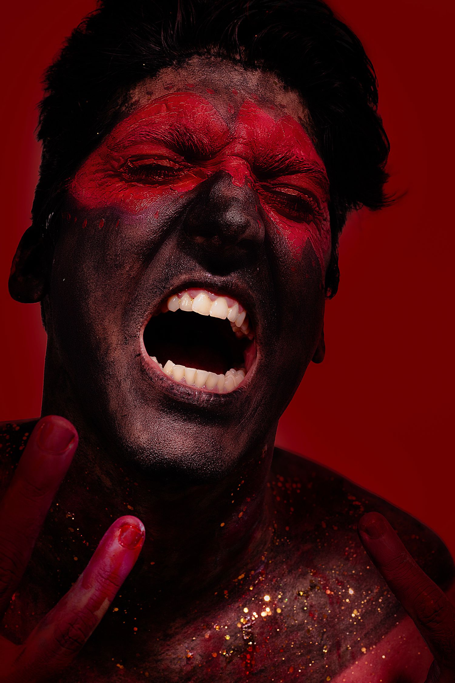 Dramatic red-tinted portrait series with gold glitter details against dark background.