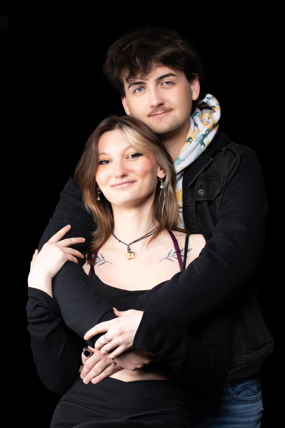 Romantic couple portrait series against black background showing intimate moments.