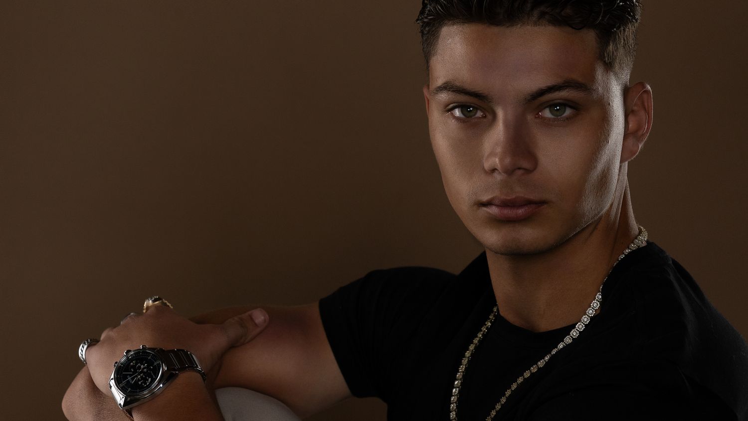 A row of six close-up portrait photos showing different facial expressions and poses against dark backgrounds.