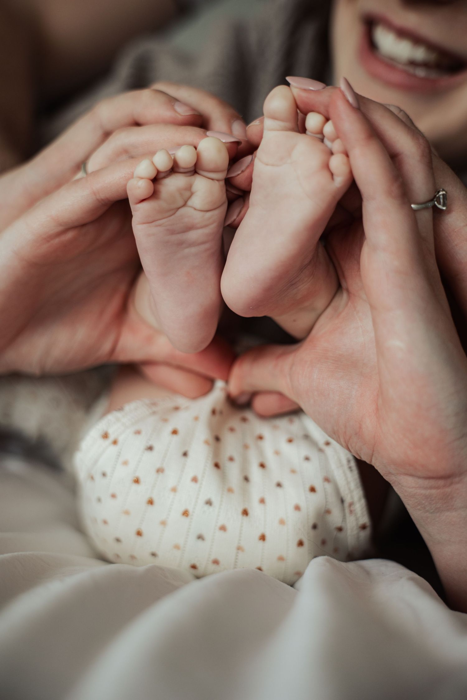 Close-up sequence of hands holding a polka dot fabric or blanket.