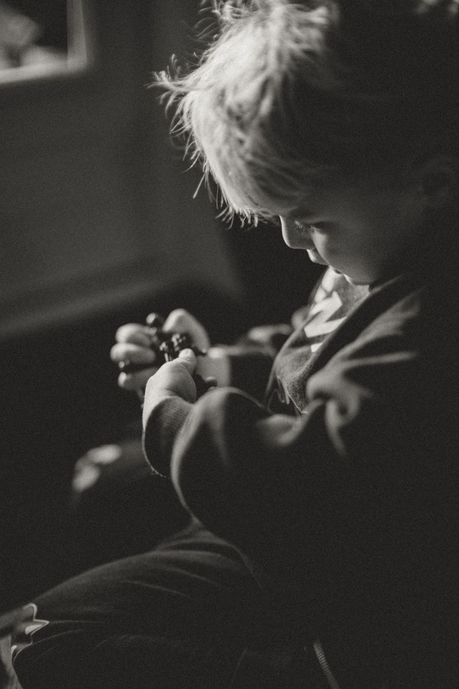 Artistic black and white close-up shot showing silhouetted details in low light.