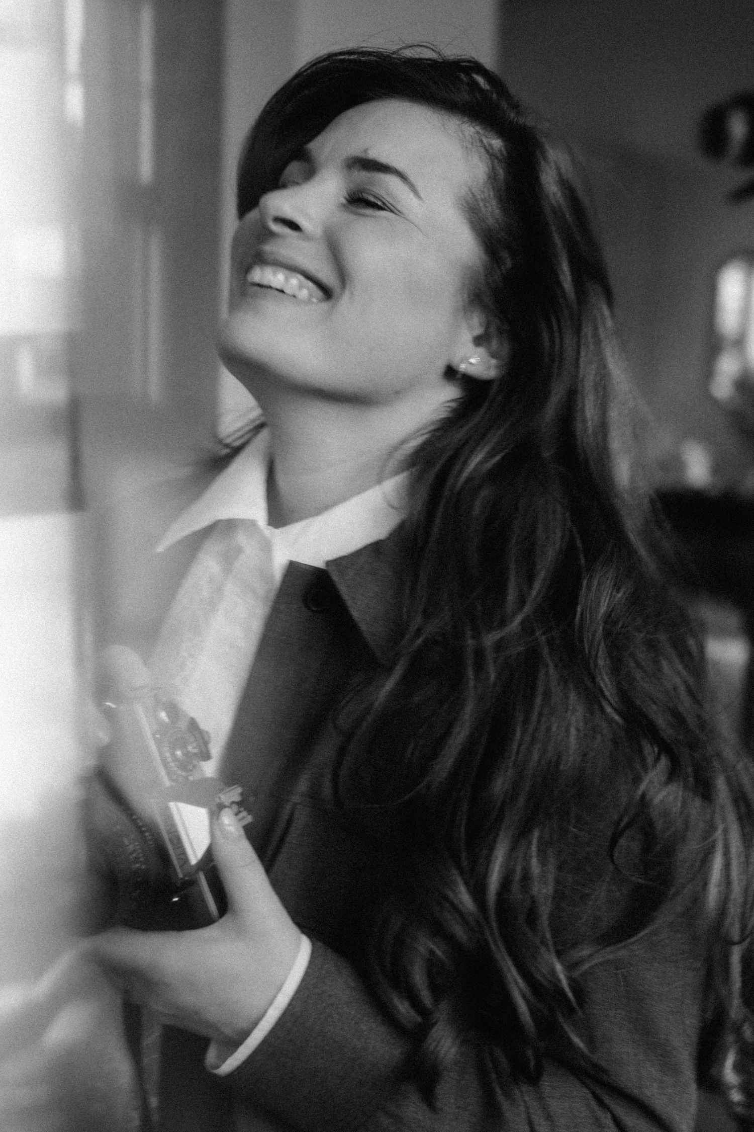 Artistic black and white portrait series showing joyful expressions and flowing hair.