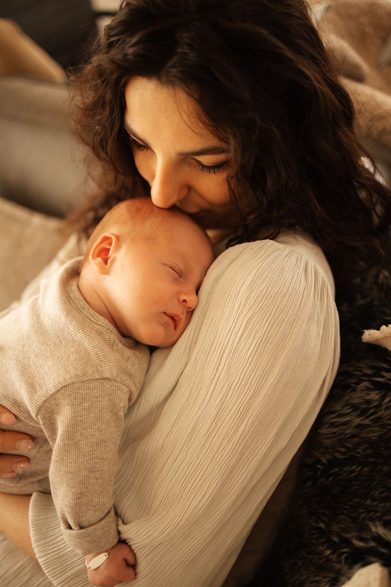 Tender moment captured of sleeping child in soft natural light.