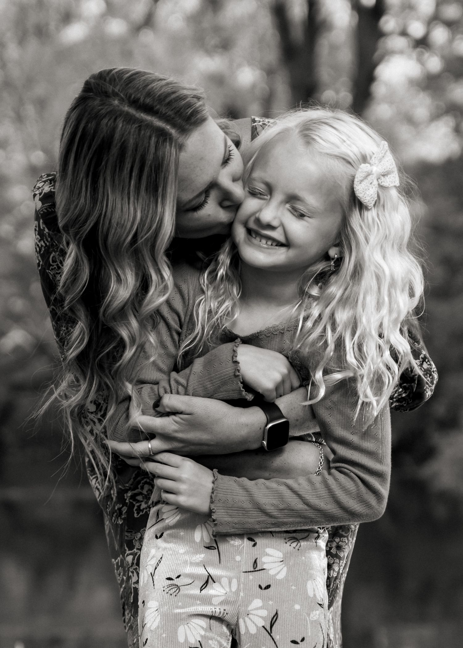 Sweet black and white moment between parent and child during outdoor photoshoot.