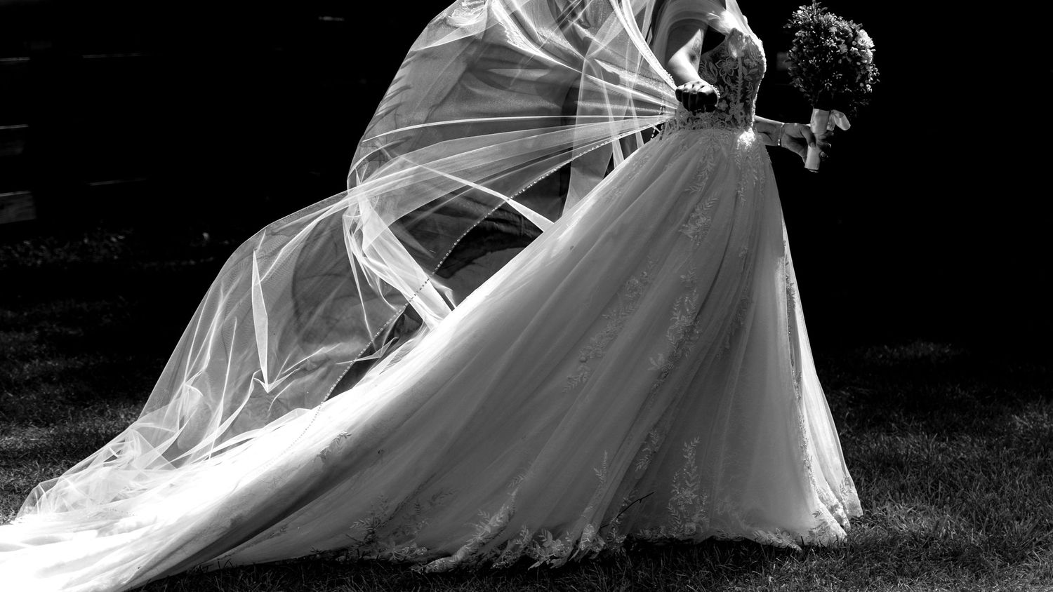 Dramatic black and white photos of flowing white wedding dresses in motion.