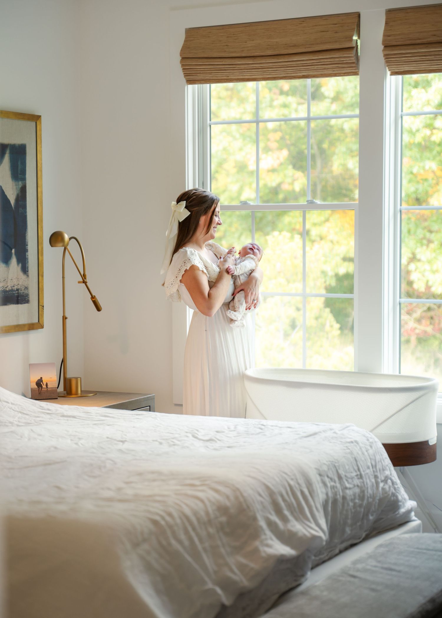 A series of photos showing a bright bedroom with white bedding and bamboo window shades.