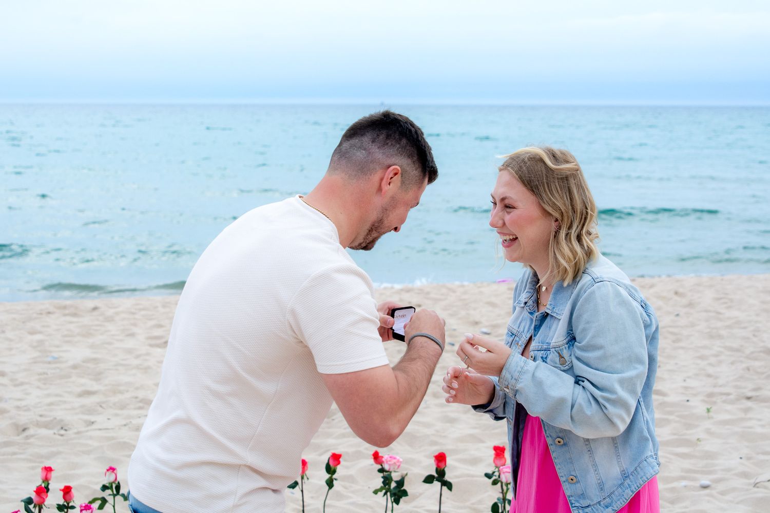 Beachside proposal sequence showing romantic moment with ocean backdrop.