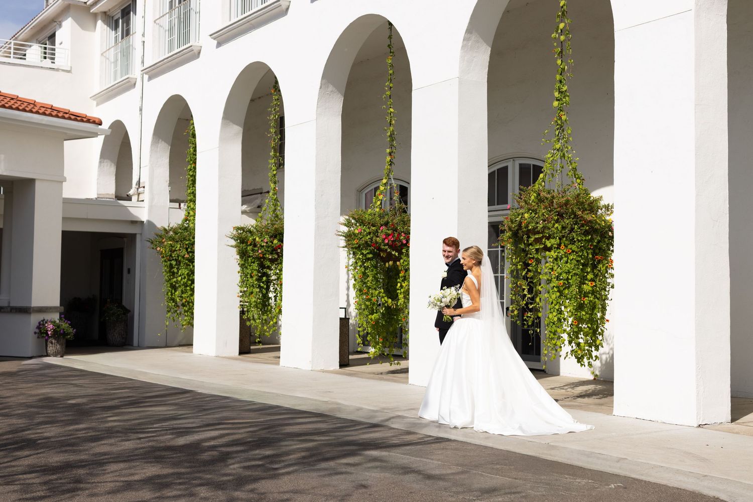A sequence of wedding photos featuring a bride in white dress posing under white arched columns.