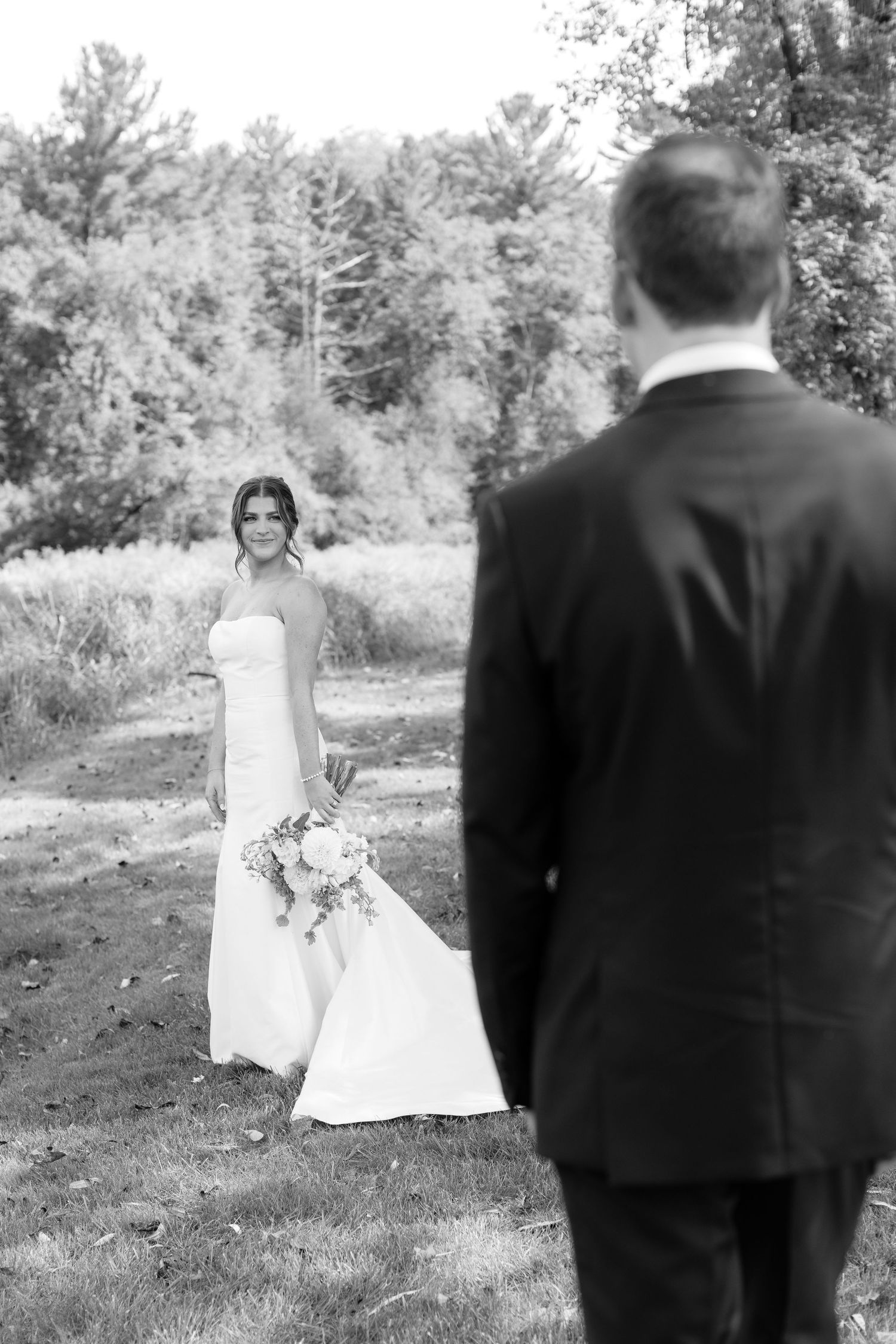 Black and white wedding portraits captured in a natural outdoor setting.