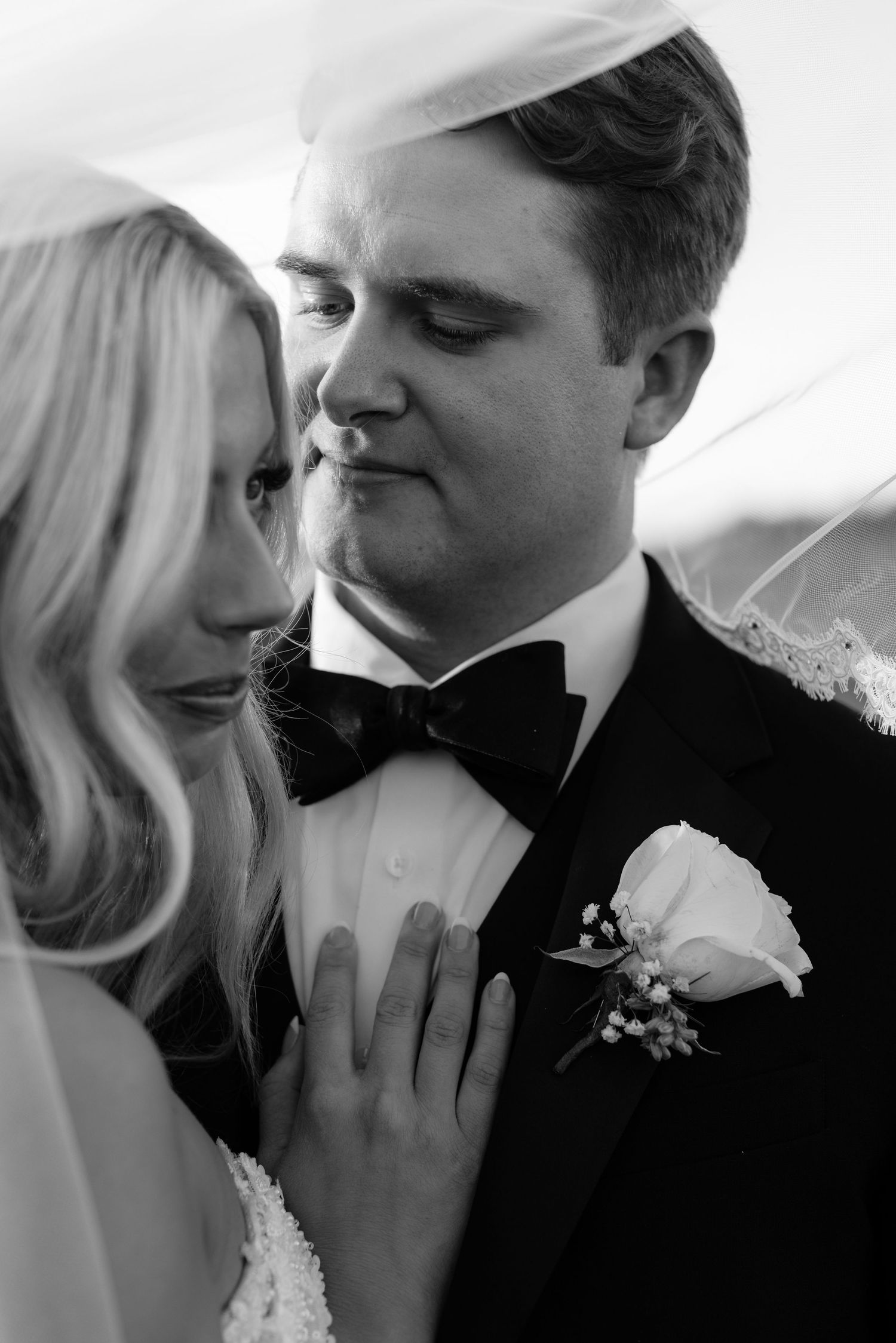 Close-up black and white wedding portraits showing intimate emotional connection.
