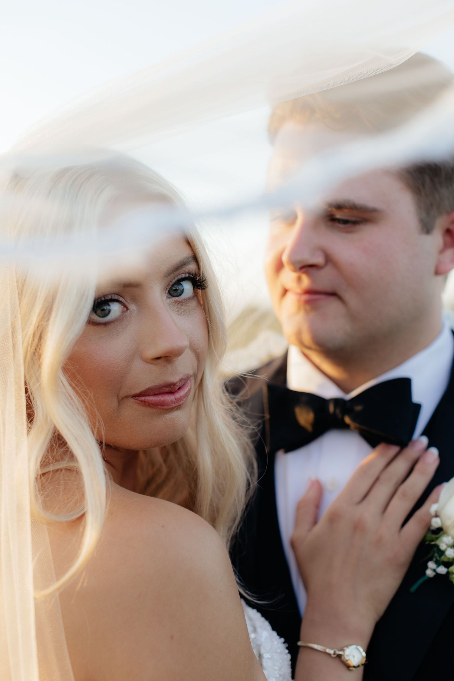 Soft focus wedding portraits capture tender moments between bride and groom.