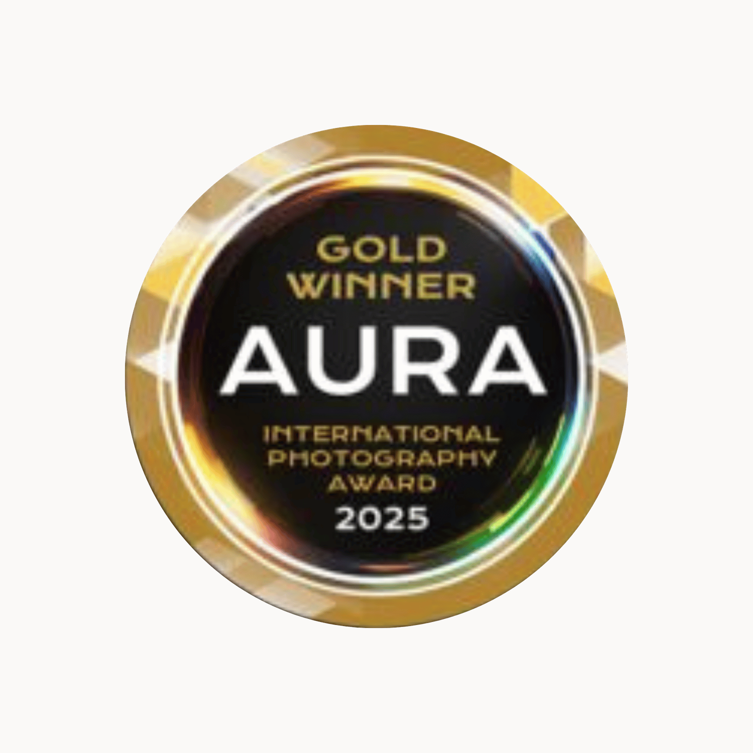 Gold Winner AURA International Photography Award 2025 medallion with black center and gold border.