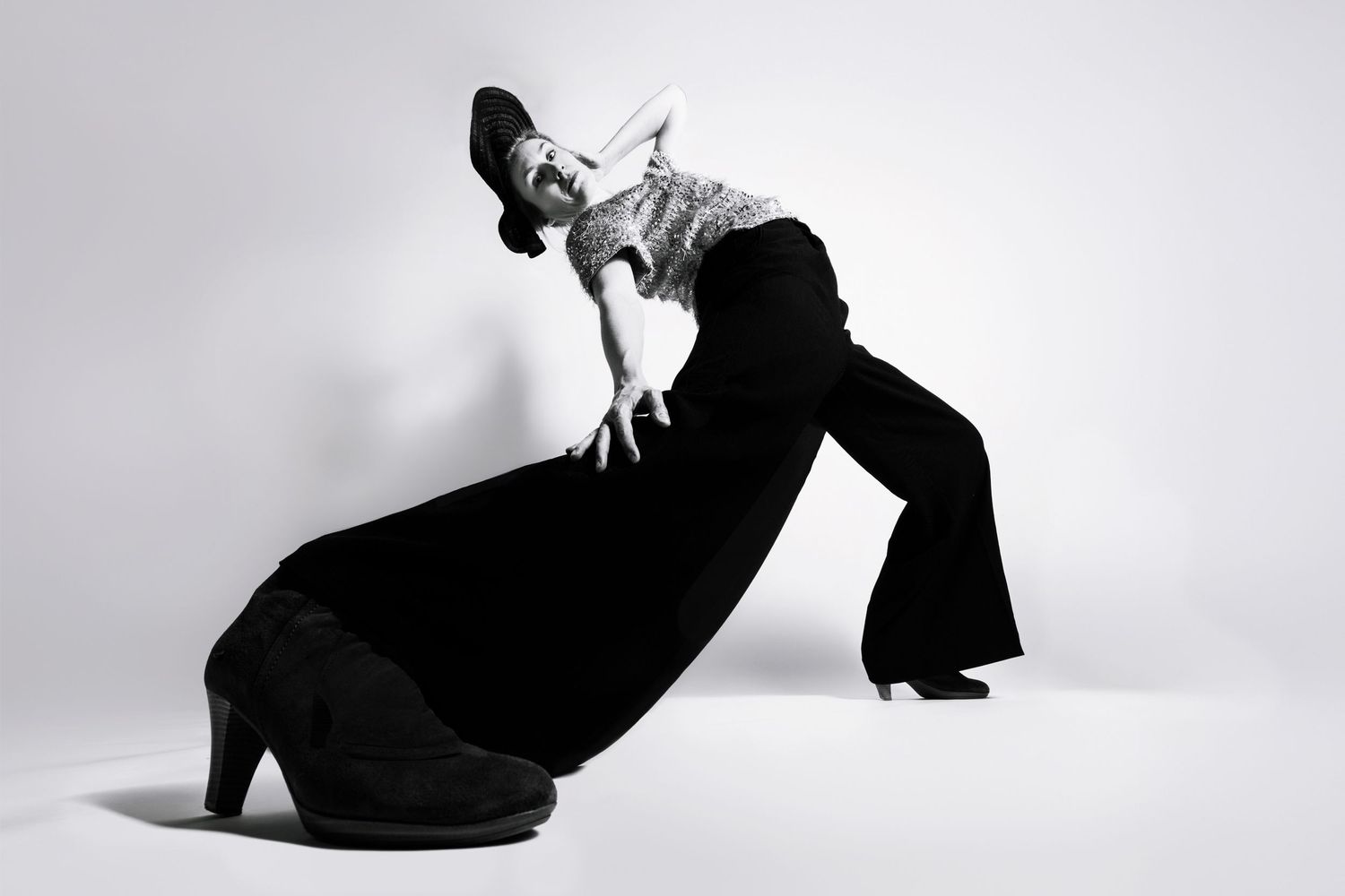 Black and white editorial portrait of a dancer in wide-leg pants and heels by fine art photographer Constanze Ariane based in theNetherlands